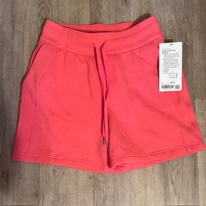These are the Lululemon Scuba High-Rise Short 5" in the color Coral Pink